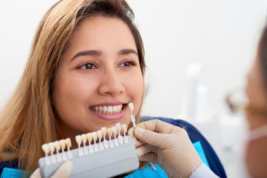 woman picking veneers